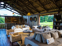 The spacious main area has a dining room, lounge, bar, and star deck all overlooking the wide-open grasslands.