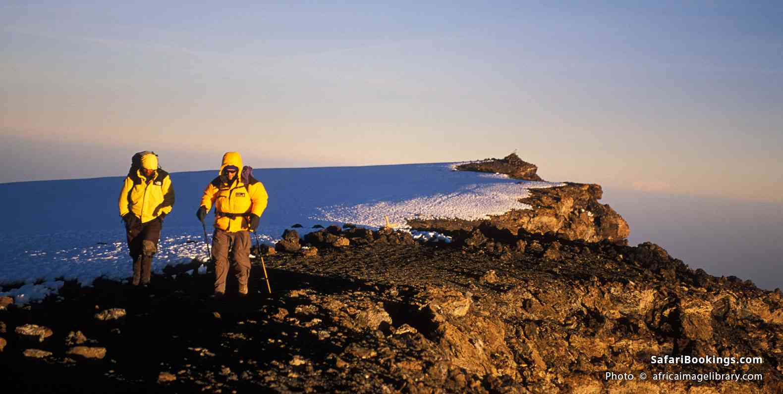 Trekkers on Uhuru Peak, the summit of Mt Kilimanjaro