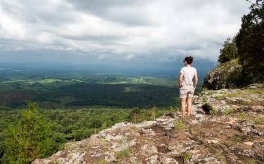 Hiker enjoying the view from Endebess Bluff