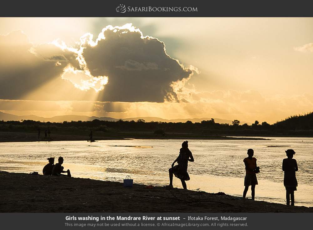 Girls washing in the Mandrare River at sunset in Ifotaka Forest, Madagascar