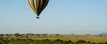 Hot-air balloon flying over the savannah
