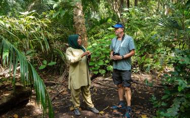 Guide and visitor on a forest hike