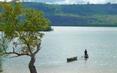 Thumbnail of Dugout canoes on the water