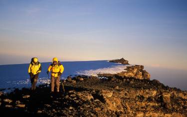 Climbers on Uhuru Peak (5,895m/19,340ft), the summit of Mt Kilimanjaro