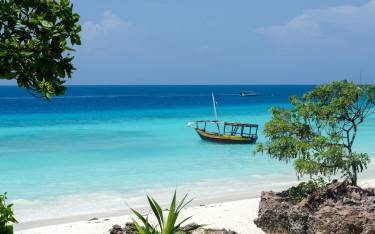 Wooden boat on turquoise water