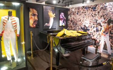 Dispays of Queen paraphernalia including Freddie Mercury's piano at the Freddie Mercury Museum