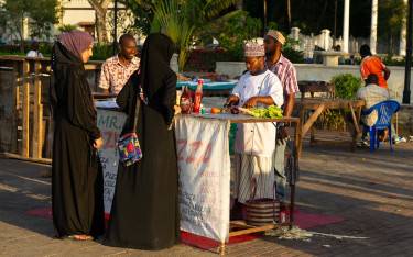 Women buying food at Forodhani Gardens