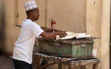 Man selling cassava in Darajani Market