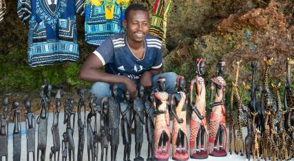 Vendor selling crafts on the beach