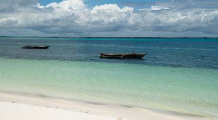Fishing boats anchored by the beach